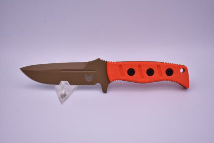 A knife with orange handle and brown blade.