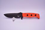 A knife with orange handles and black handle.