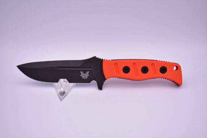 A knife with orange handles and black handle.