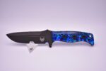 A knife with blue flowers on it.