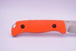 A knife that is orange and black