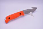 A knife with an orange handle and black dots.